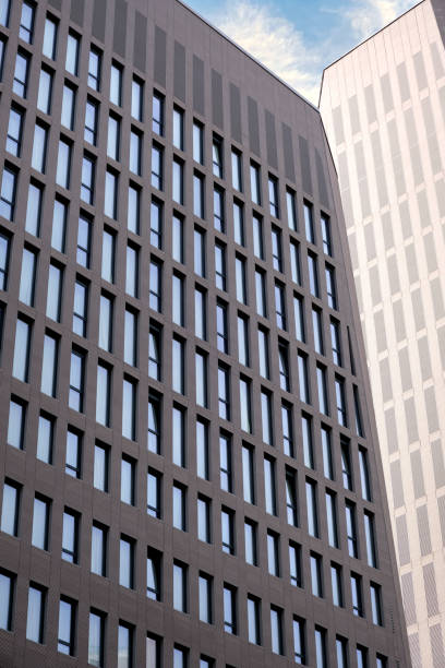 istock Two beautiful modern office skyscrapers against the sky. 1470779479