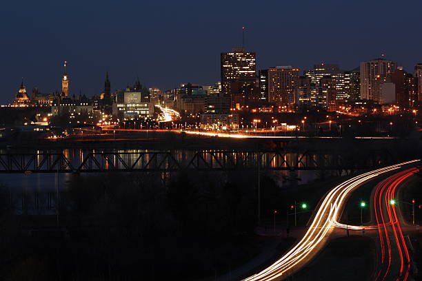 Beautiful view city of Ottawa at night The Ottawa skyline at night from the Ottawa River Parkway. fairmont chateau laurier stock pictures, royalty-free photos & images