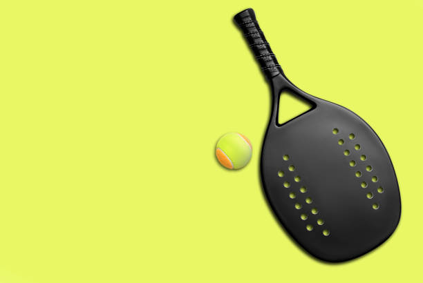 Black professional beach tennis racket and ball on yellow background. Horizontal sport theme poster, greeting cards, headers, website and app Black professional beach tennis racket and ball on yellow background. Horizontal sport theme poster, greeting cards, headers, website and app racket stock pictures, royalty-free photos & images