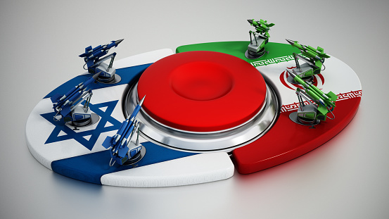 Rising tension between Israel and Iran. Missiles on Israeli and Iranian flags at the opposite sides of the red button.