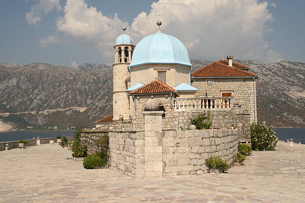 Baroque church on islet in Boka Bay, Montenegro stock photo