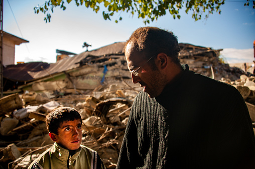 Van, Turkey - October 28, 2011: Van Earthquake 7.2 / Earthquake survivor father and son