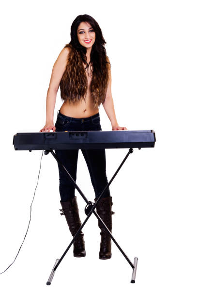 Bautiful woman wearing a leather jacket and playing an electric guitar