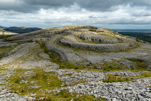 Iconic spiral shaped limestone rock formations of Slieve Rua hill, The Burren National Park, County Clare, Ireland