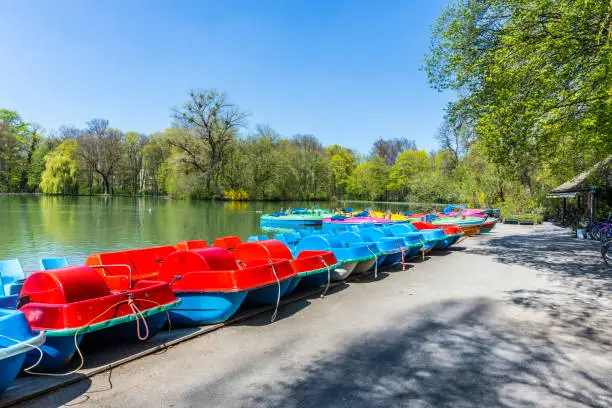 boats for rent at the  Seehaus in Munich, Germany. This pier is placed at the Kleinhesseloher lake in the English Garden.