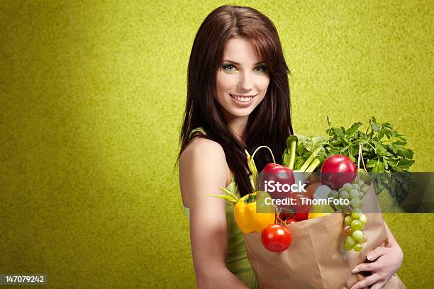Woman Holding In Hands Full Of Different Fruits And Vegetables Stock Photo - Download Image Now