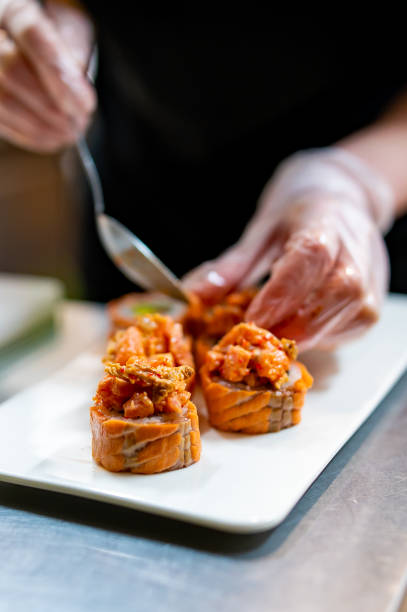 istock professional chef's hands making sushi and rolls in a restaurant kitchen 1470796187