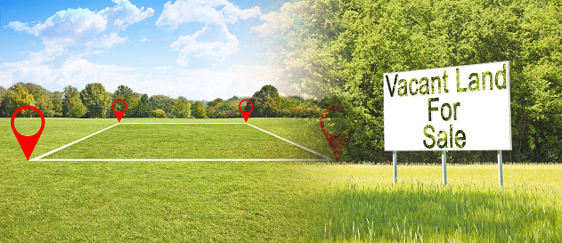 Land plot management - real estate concept with a vacant lot for sale available for building construction in a residential area - concept with an advertising billboard in a rural scene
