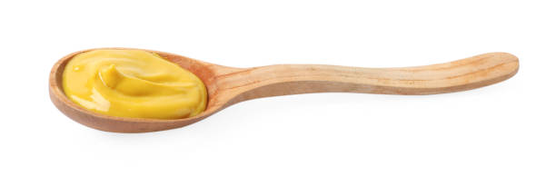 istock Delicious mustard in wooden spoon isolated on white 1470797238