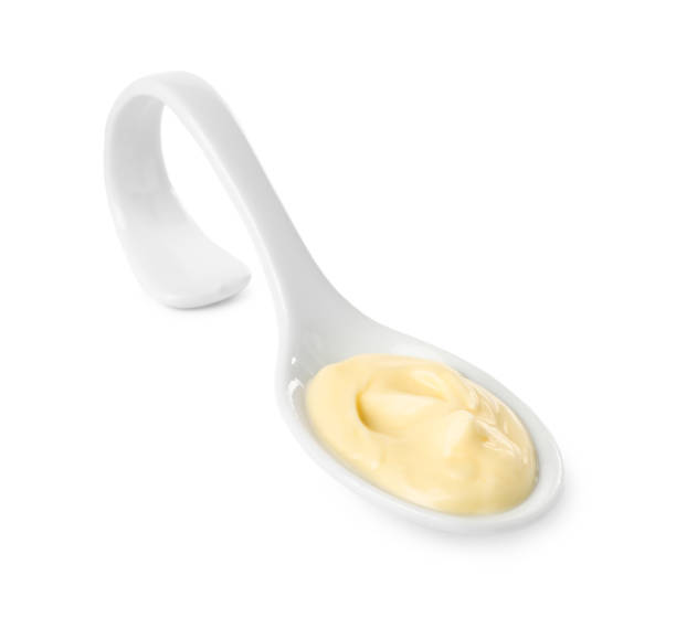 istock Mayonnaise in ceramic serving spoon isolated on white 1470797249