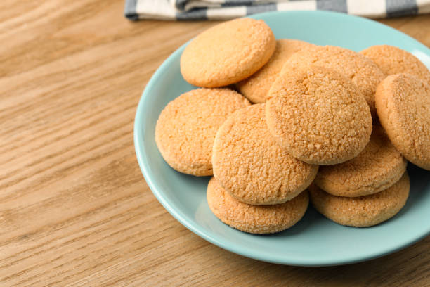 istock Delicious sugar cookies on wooden table, closeup. Space for text 1470797353