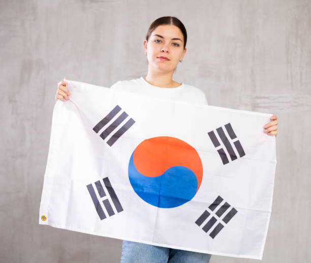 istock Focused woman holding South Korea flag 1470797449