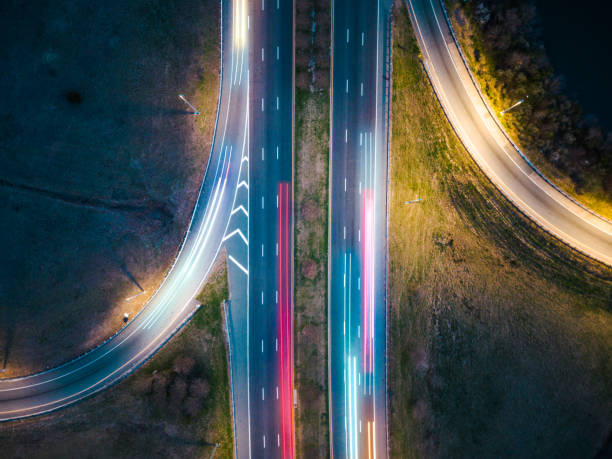 istock Interstate Dusk - Cars Traveling on Highway with Light Trails - Interweaving Braid - Exits 1470801691
