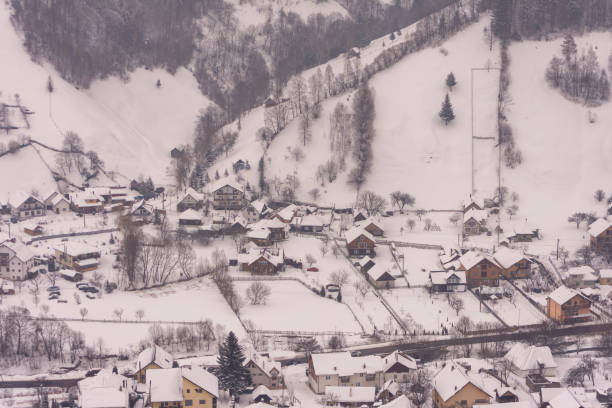 Little village in the valley on Rucar-Bran pass in Carpathian mountains - Romania