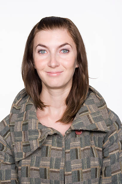 istock Smiling Woman Wearing Patterned Coat. Isolated. 147080515