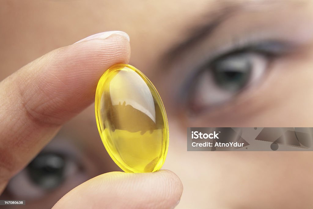 Retención de vitamina cápsula - Foto de stock de Complemento vitamínico libre de derechos