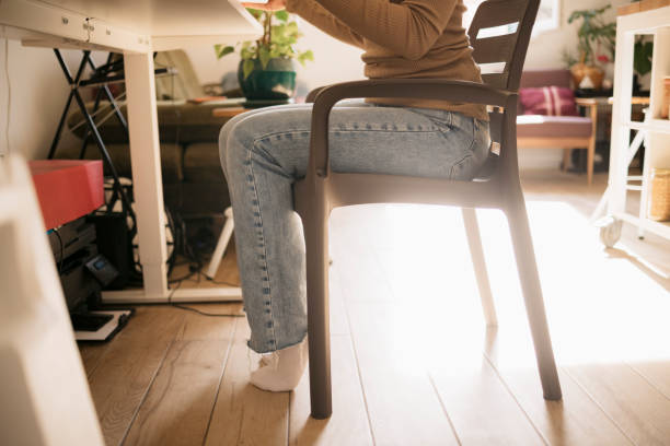 istock Woman sitting on a plastic chair at home 1470806906