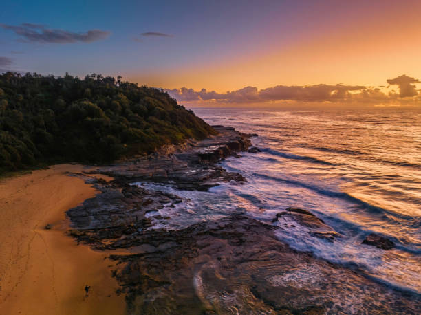 istock Summer sunrise at the seaside with clouds and rocks 1470809595