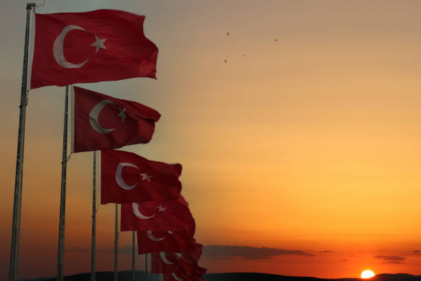 istock Turkish flags in a row with a sunset in the background 1470812530
