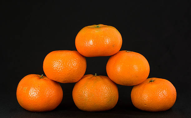 Tangerine pyramid stock photo