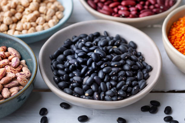 istock Different types of legumes in bowls - black beans 1470821286