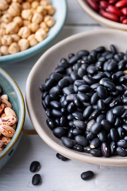 istock Different types of legumes in bowls - black beans 1470821294