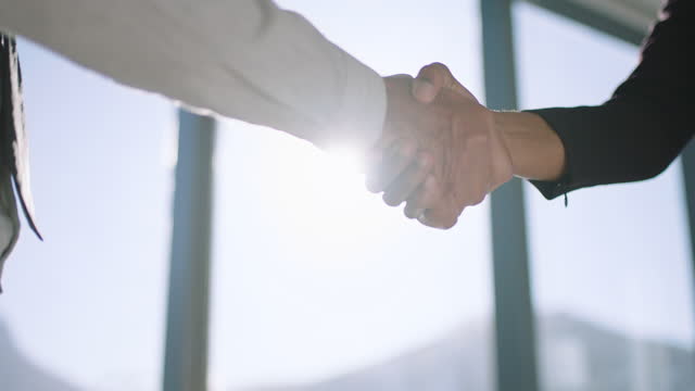 close up handshake business people shaking hands successful corporate partnership deal welcoming opportunity for cooperation in office 4k footage