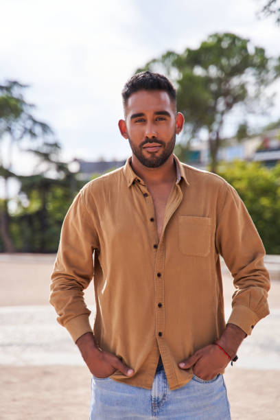 istock vertical portrait of a latin man with beard smiling. 1470821427