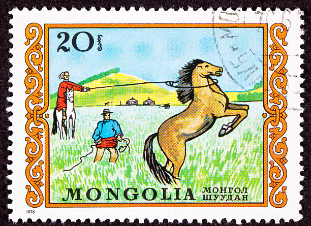 istock Canceled Mongolian Postage Stamp Men Capturing Lassoing Wild Horse Grassland 147082268