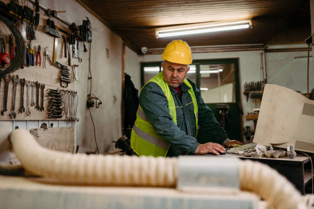 istock Male carpenter working on wooden plank 1470823118