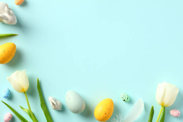 istock Happy Easter background with tulips and colorful eggs. Flat lay, top view. 1470824111