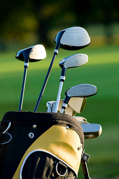 istock Five golf clubs in golfing bag on golf course 147082420