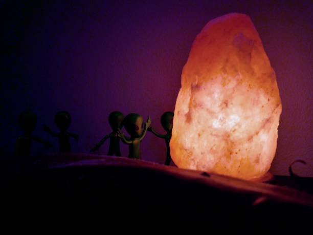 istock Green aliens discover a salt rock lamp 1470825614