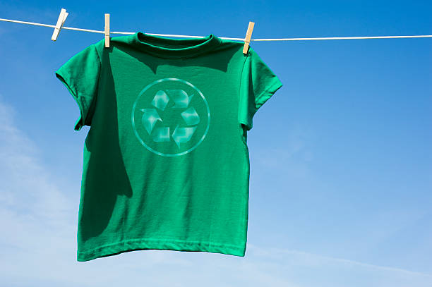 Green T-Shirt with a Recycle Logo stock photo