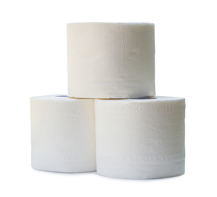 three rolls of white tissue paper or napkin in stack prepared for use in toilet or restroom are isolated on white background with clipping path.