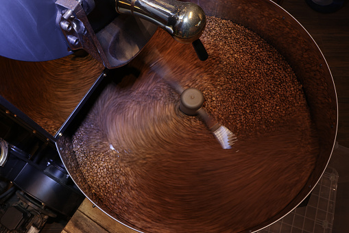 Ground coffee and Coffee beans with a coffee grinder