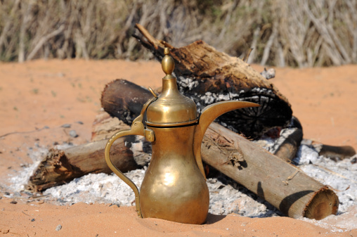 Arabic coffee pot at fireplace