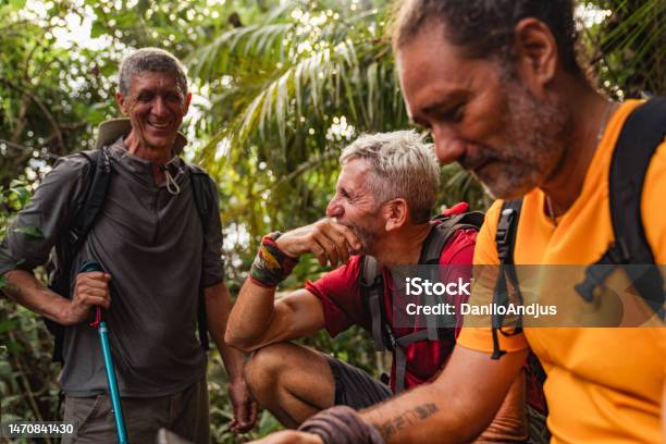 Three Hikers Having A Break In Wilderness Stock Photo - Download Image Now - Senior Adult, Friendship, Mature Men