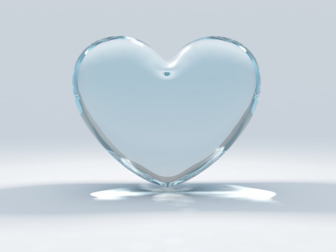 Glass heart set on a blue and white background