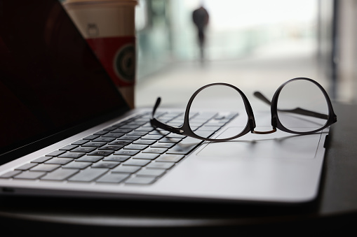 Eyeglasses on laptop