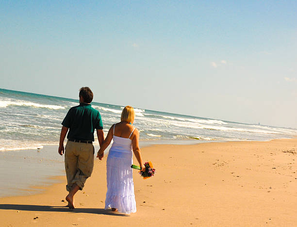 couple on beach stock photo