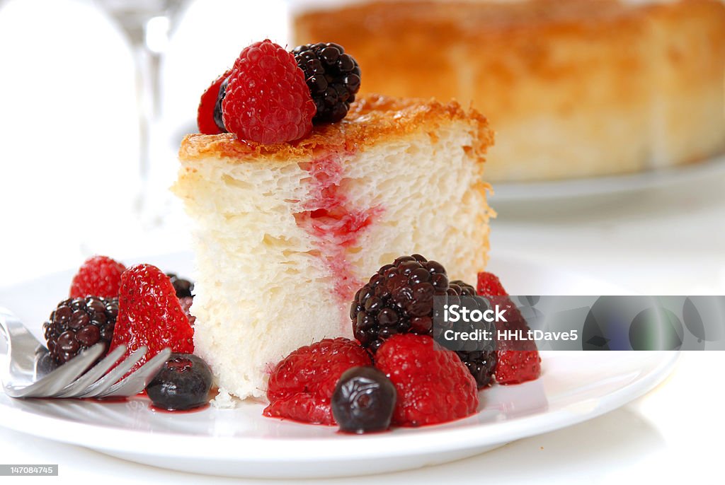 Slice of Angel Food Cake with fresh fruit Slice of freshly baked Angel Food Cake with fresh fruit Baked Stock Photo