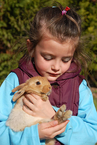 istock little girl and bunny 147085080