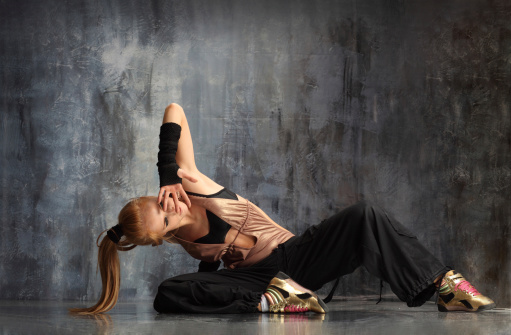 modern style dancer posing behind studio background http://www.ayakovlev.com/lb/street.jpg