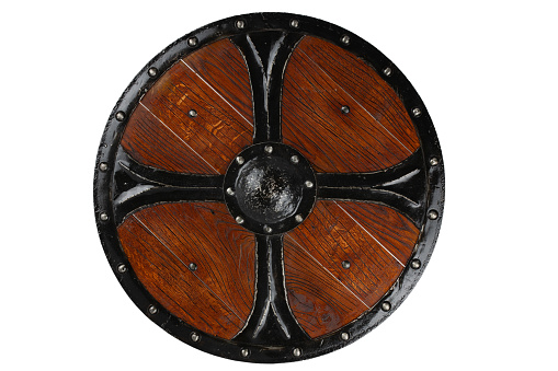 Old wooden viking pattern round shield era.