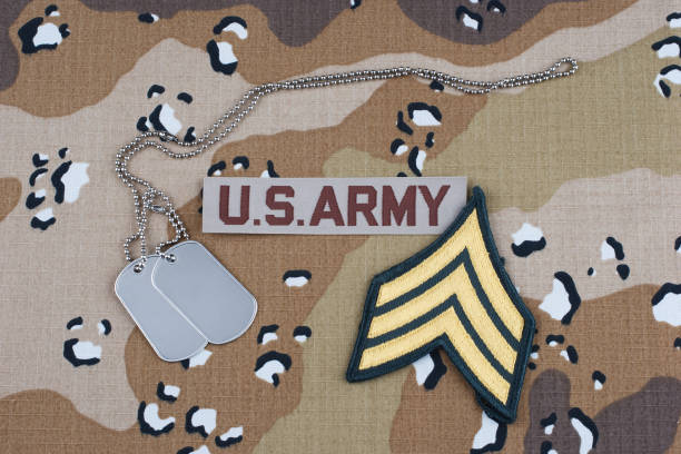 istock US ARMY sergeant rank patch and dog tags on Desert Battle Dress Uniform 1470851788