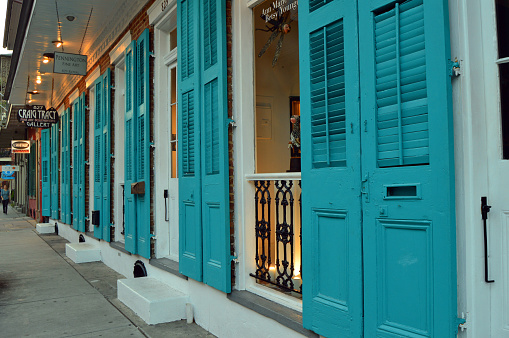 New Orleans, LA, USA June 7 Blue wooden shutter doors are open for the business in the French Quarter in New Orleans