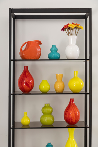 Shelf with glass vases in the house