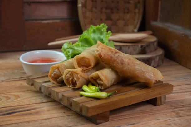 Selective focus on the lumpia or lunpia is a typical snack from Java in Indonesia, in English it is often called spring rolls, soft focus stock photo