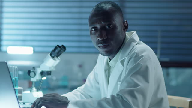 Portrait of African American Lab Scientist with Laptop